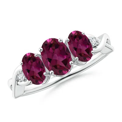 ANGARA OVAL RHODOLITE THREE STONE CRISS-CROSS RING