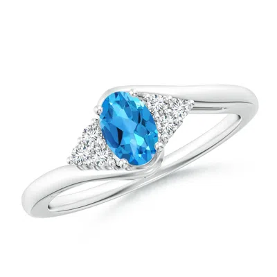 ANGARA OVAL SWISS BLUE TOPAZ BYPASS RING WITH TRIO DIAMOND ACCENTS