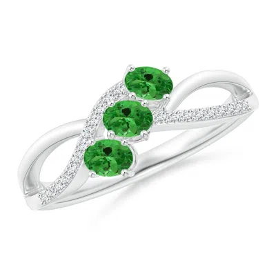 ANGARA OVAL TSAVORITE THREE STONE BYPASS RING WITH DIAMONDS