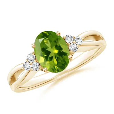 ANGARA SOLITAIRE OVAL PERIDOT SPLIT SHANK RING WITH TRIO DIAMONDS