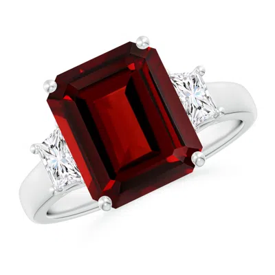 ANGARA THREE STONE EMERALD-CUT GARNET AND DIAMOND RING
