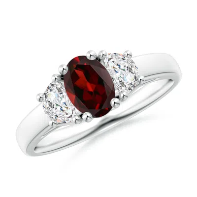 ANGARA THREE STONE OVAL GARNET AND HALF MOON DIAMOND RING