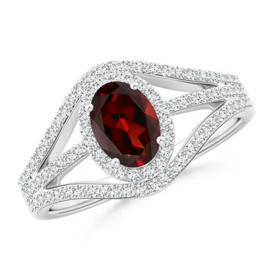 ANGARA TRIPLE SHANK OVAL GARNET AND DIAMOND HALO RING
