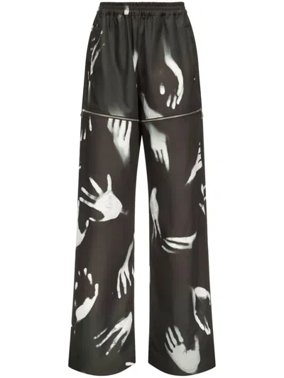 AREA HANDPRINT SLIT TRACK PANTS