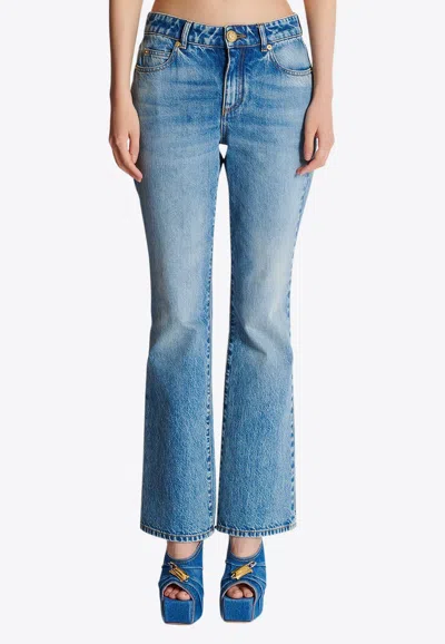 BALMAIN WASHED-OUT FLARED DENIM PANTS