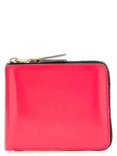 COMME DES GARÇONS FLUO LEATHER LINE WALLETS AND CARD HOLDERS FUCHSIA