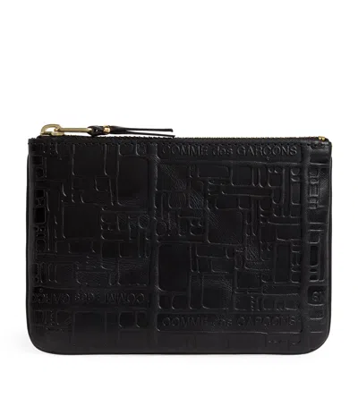 COMME DES GARÇONS LEATHER LOGO EMBOSSED ZIPPED POUCH