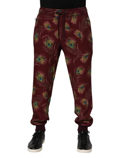 DOLCE & GABBANA BURGUNDY PEACOCK FEATHER PRINT JOGGER PANTS