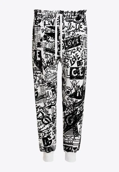 DOLCE & GABBANA GRAFFITI PRINT TRACK PANTS