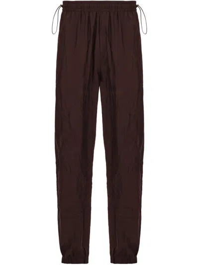 FERRAGAMO CRINKLED TRACK PANTS