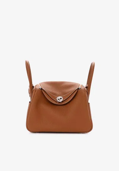 HERMES LINDY 26 IN GOLD TAURILLON CLEMENCE WITH PALLADIUM HARDWARE