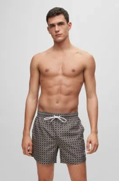 HUGO BOSS LOGO SWIM SHORTS WITH ALL-OVER SEASONAL PATTERN