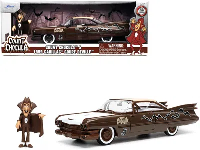 JADA 1959 CADILLAC COUPE DEVILLE BROWN AND WHITE WITH GRAPHICS AND COUNT CHOCULA DIECAST FIGURINE "HOLLYW