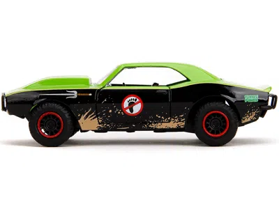 JADA 1967 CHEVROLET CAMARO "TEENAGE MUTANT NINJA TURTLES" BLACK AND GREEN (DIRTY) "HOLLYWOOD RIDES" SERIE