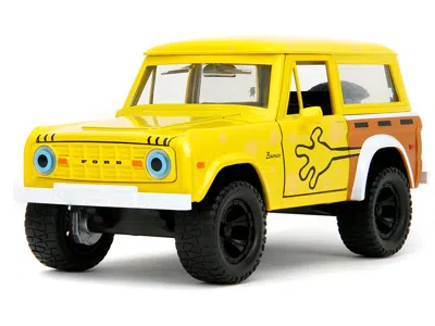 JADA 1973 FORD BRONCO YELLOW WITH GRAPHICS AND SPONGEBOB SQUAREPANTS DIECAST FIGURE "SPONGEBOB SQUAREPANT