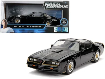 JADA TEGOÂ€S 1977 PONTIAC FIREBIRD BLACK "FAST & FURIOUS" MOVIE 1/24 DIECAST MODEL CAR BY JADA