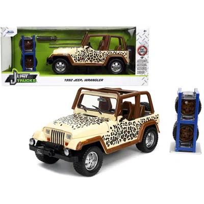 JADA TOYS JADA SERIES 1-24 DIECAST MODEL CAR FOR 1992 JEEP WRANGLER TAN & BROWN WITH GRAPHICS & EXTRA WHEELS J