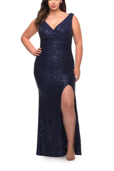 LA FEMME LA FEMME STRETCH SEQUIN PLUS SIZE GOWN WITH SLIT AND V NECK