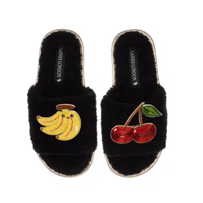 LAINES LONDON WOMEN'S TEDDY SLIDER SLIPPERS WITH LAINES LOVABLES BANANA & CHERRY BROOCHES - BLACK
