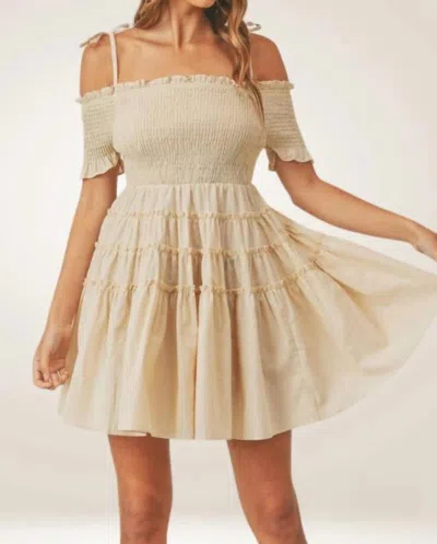 MABLE LESLIE SMOCKED OFF-SHOULDER MINI TIERED DRESS IN BEIGE
