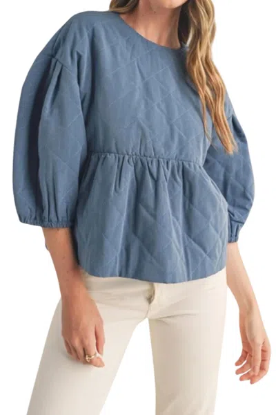 MERCI QUILTED BABYDOLL TOP IN DENIM BLUE