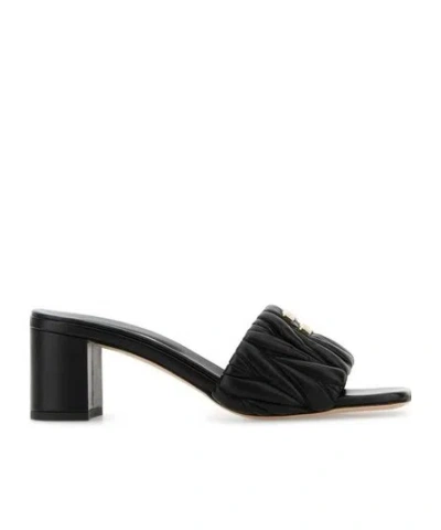 MIU MIU MIU MIU LOGO-LETTERING SLIP-ON SANDALS