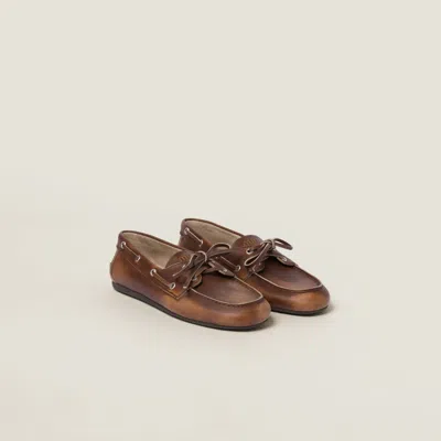 MIU MIU UNLINED BLEACHED LEATHER BOAT SHOES