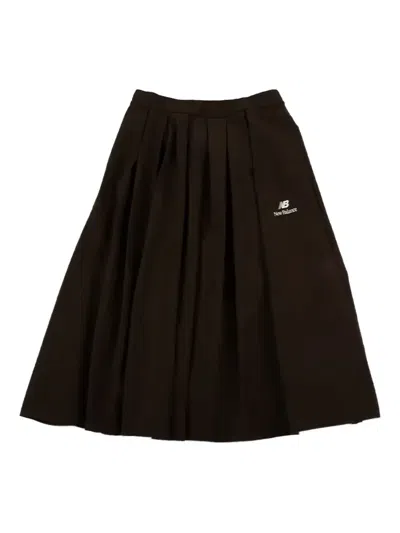 NEW BALANCE PLEATED MIDI SKIRT