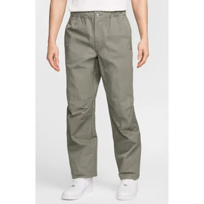 NIKE NIKE TECH WOVEN FLAT FRONT PANTS