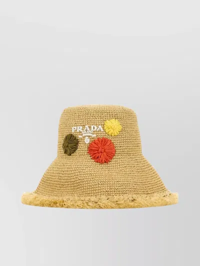 PRADA EMBELLISHED FLORAL RAFFIA HAT WITH FRAYED EDGE
