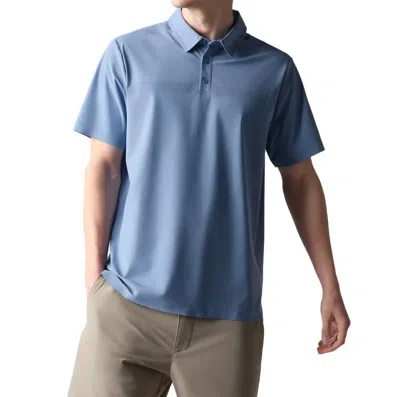 RHONE TECH POLO SHIRT IN HORIZON BLUE