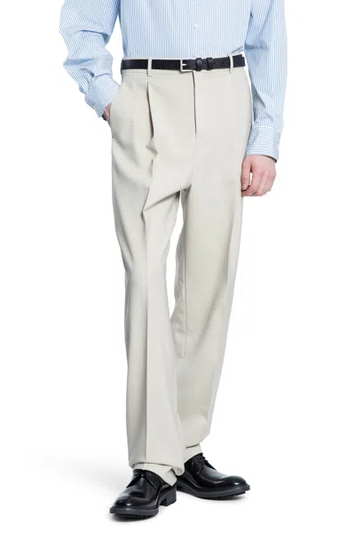 SAINT LAURENT PLEATED WOOL CARROT PANTS