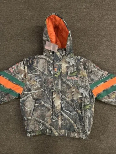 SUPREME SUPREME MITCHELL & NESS NCAA HOODED STADIUM JACKET WOODLAND CAMO SMALL CONFIRMED