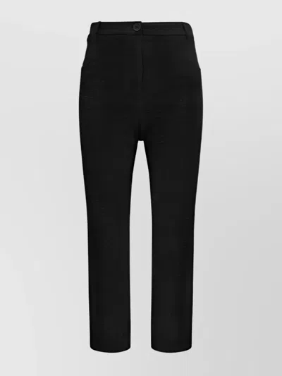 THE ANDAMANE BOOT-CUT TROUSERS WITH SIDE AND WELT POCKETS