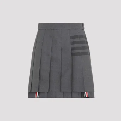 THOM BROWNE THIGH LENGTH DROPPED BACK PLEATED SKIRT