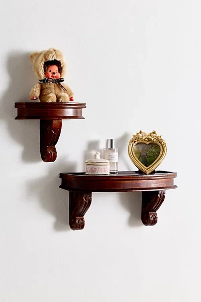 URBAN OUTFITTERS CORINNE CARVED MANGO WOOD WALL SHELF IN DARK BROWN AT URBAN OUTFITTERS