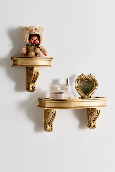 URBAN OUTFITTERS CORINNE CARVED MANGO WOOD WALL SHELF IN GOLD AT URBAN OUTFITTERS