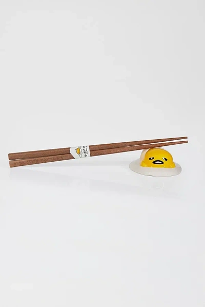URBAN OUTFITTERS GUDETAMA THE LAZY EGG CERAMIC CHOPSTICK HOLDER SET IN YELLOW AT URBAN OUTFITTERS