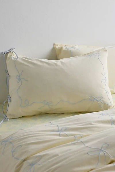 URBAN OUTFITTERS LACEY BOWS EMBROIDERED SHAM SET IN BRIGHT YELLOW AT URBAN OUTFITTERS