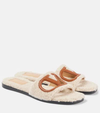 VALENTINO GARAVANI VLOGO CUTOUT FAUX SHEARLING SLIDES