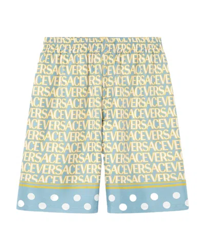 VERSACE VERSACE ALL-OVER LOGO PRINTED KNEE-LENGTH SHORTS
