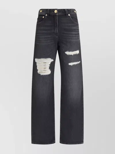 VERSACE DISTRESSED WIDE-LEG JEANS CUT-OUTS
