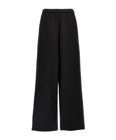 VETEMENTS VETEMENTS LOGO EMBROIDERED WIDE LEG PANTS