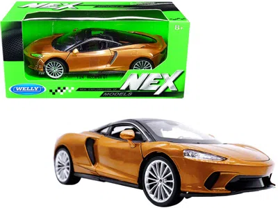 WELLY MCLAREN GT GOLD METALLIC WITH BLACK TOP "NEX MODELS" 1/24 DIECAST MODEL CAR BY WELLY